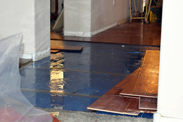 Professional Flood Damage Restoration technician working in Leominster, MA